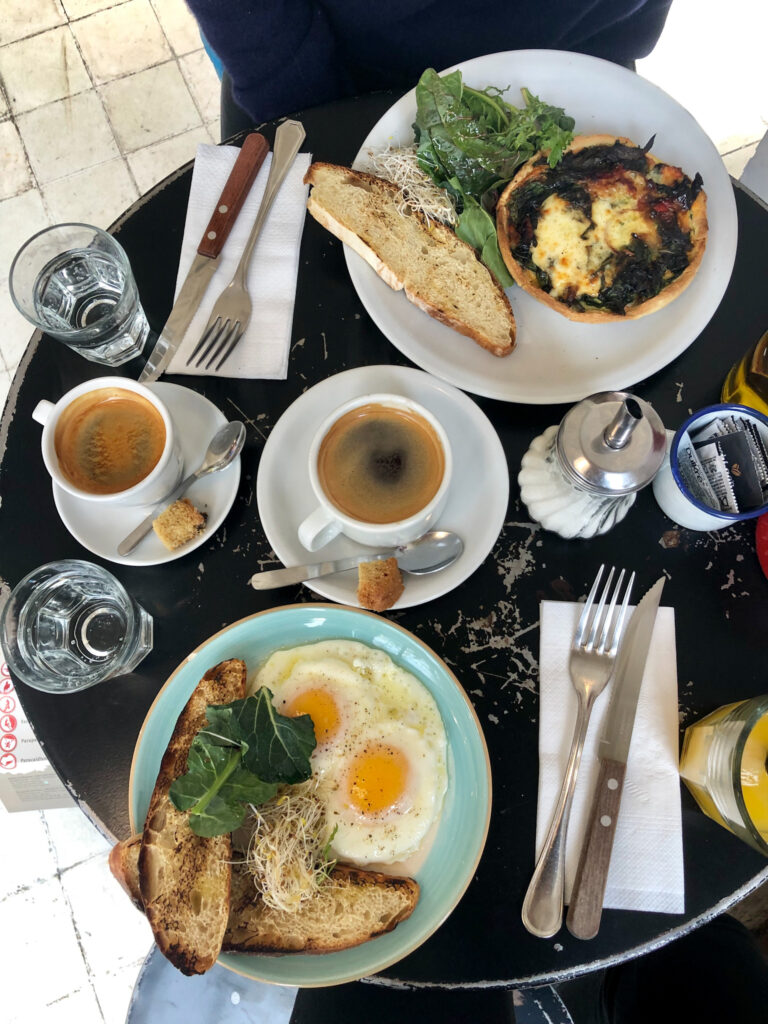 A delicious breakfast platter of eggs, toast, and coffee