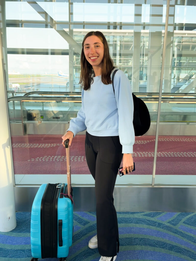 Girl at the airport with a suitcase