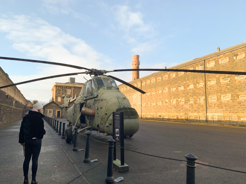 Girl looking at a helicopter at the Crumlin Road Gaol in Belfast