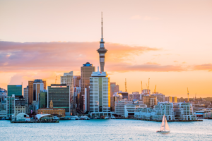 View of the Sky Tower and harbor in Auckland during sunset