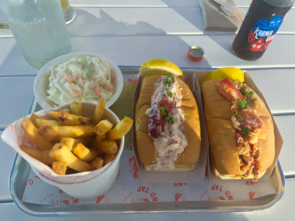 2 lobster rolls and fries on a platter